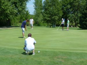 A team at the putting green